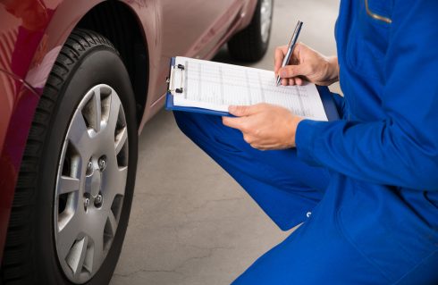 mechanic conducting vehicle safety inspection